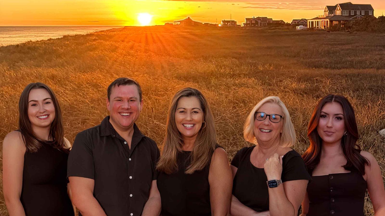 The Nantucket Luxury team on the bluff at sunset